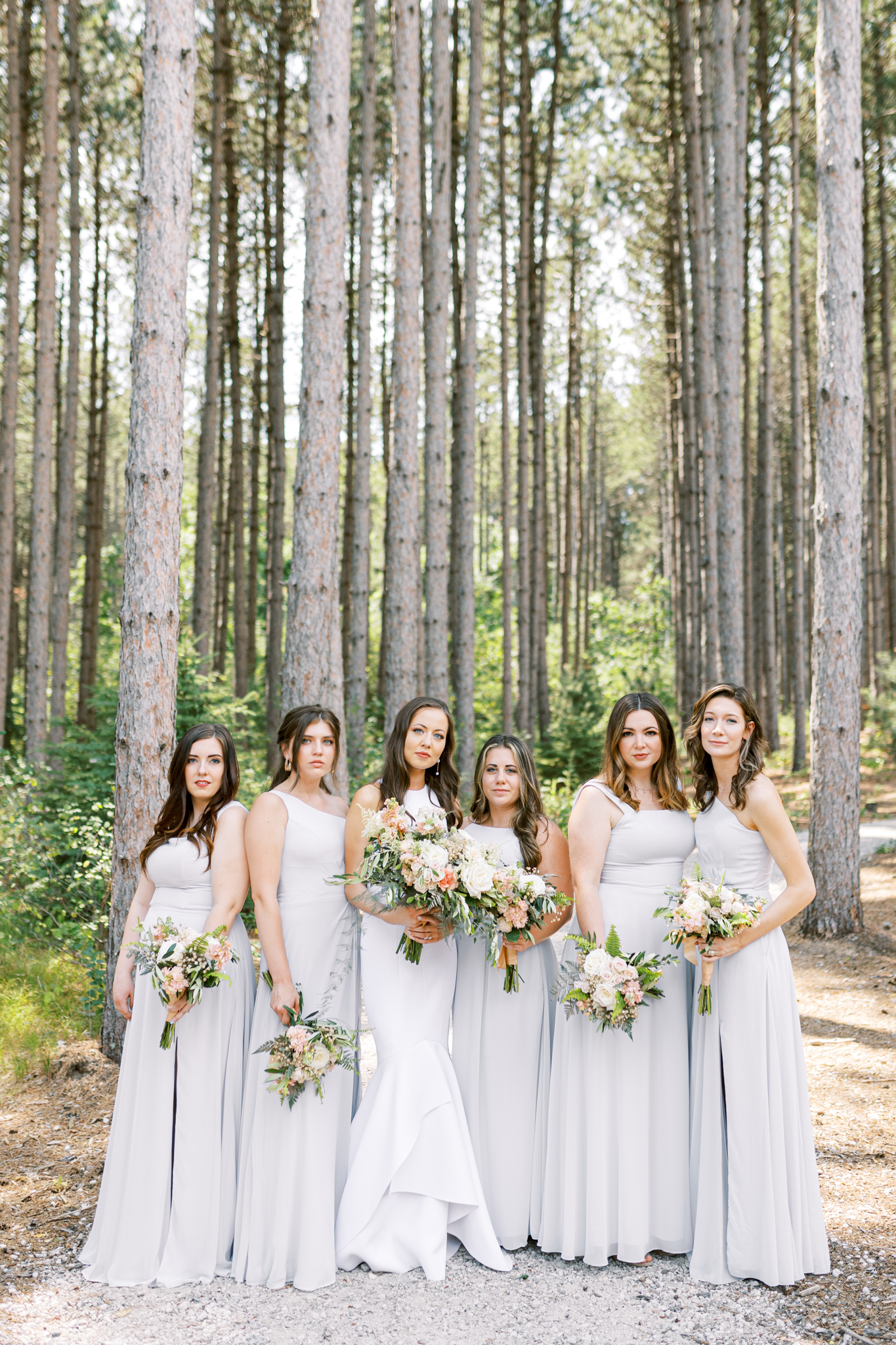 Light gray bridesmaids at Pinewood Wedding Venue
